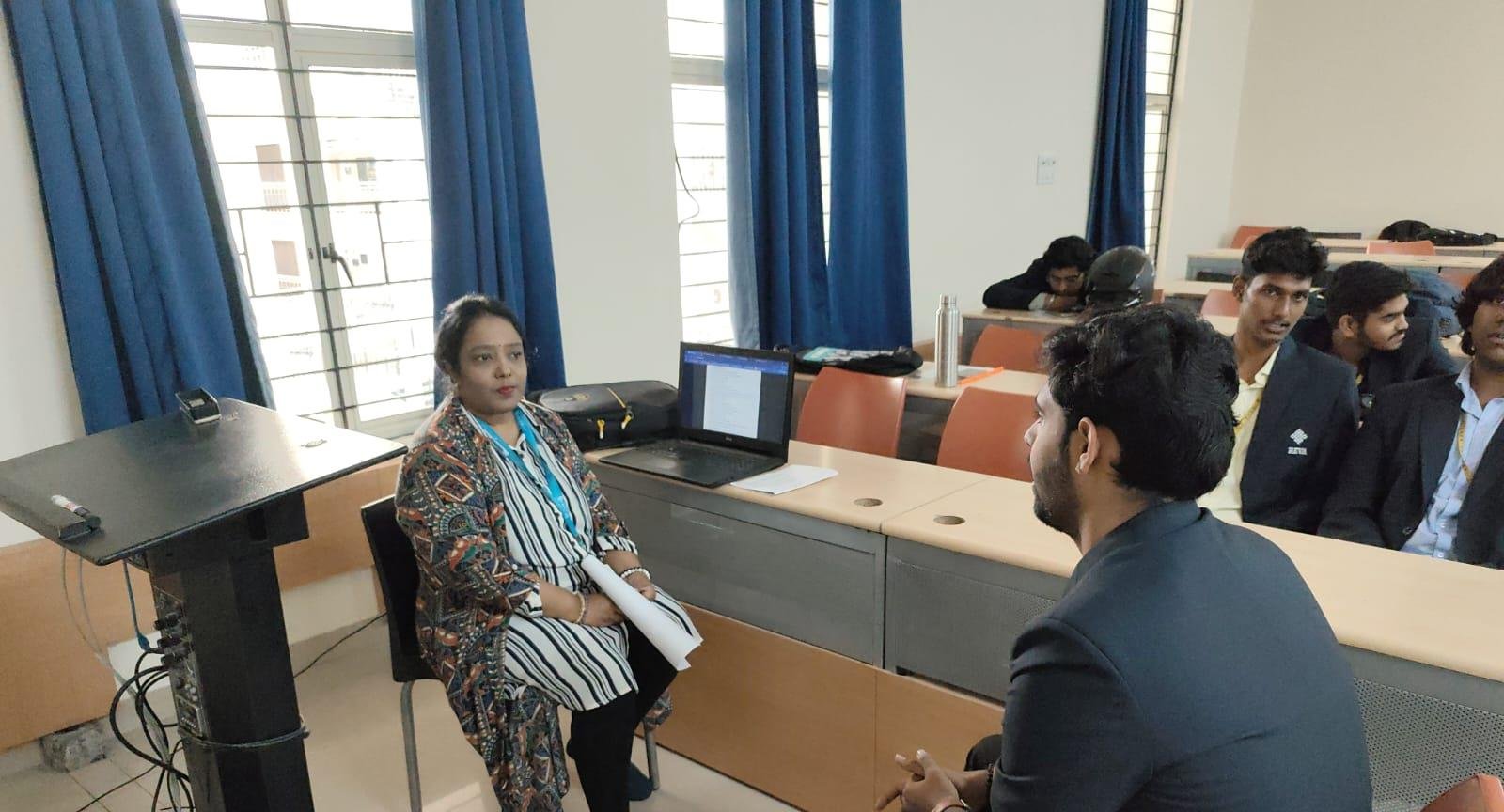 Dr. Saraswathi Bhasin in conversation with students during a university training session